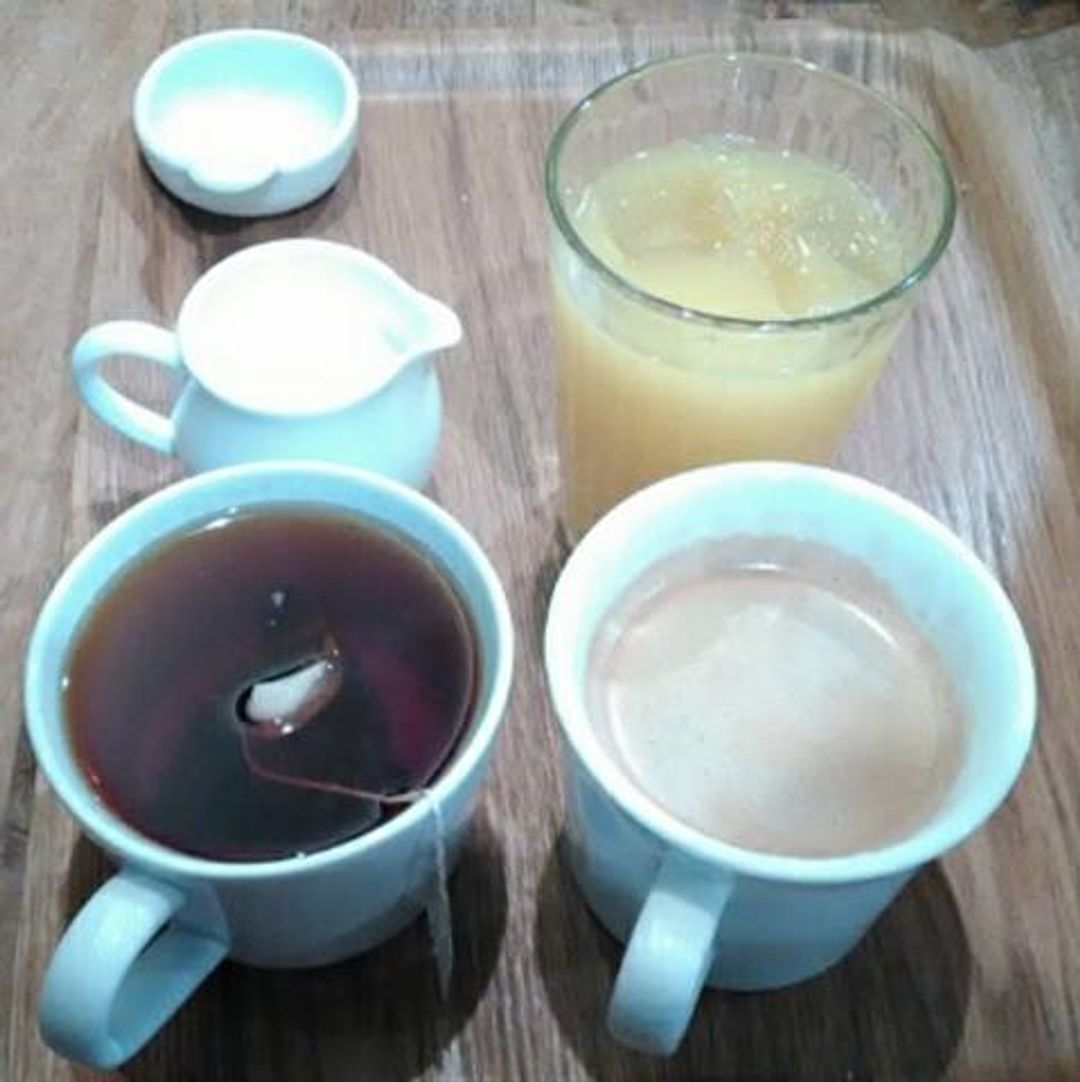 Coffee, orange juice, tea with milk